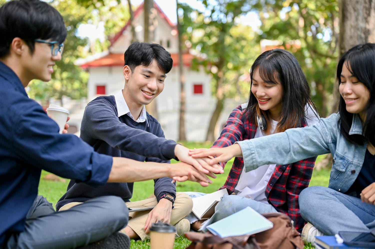 Image of a group of students supporting one another on campus